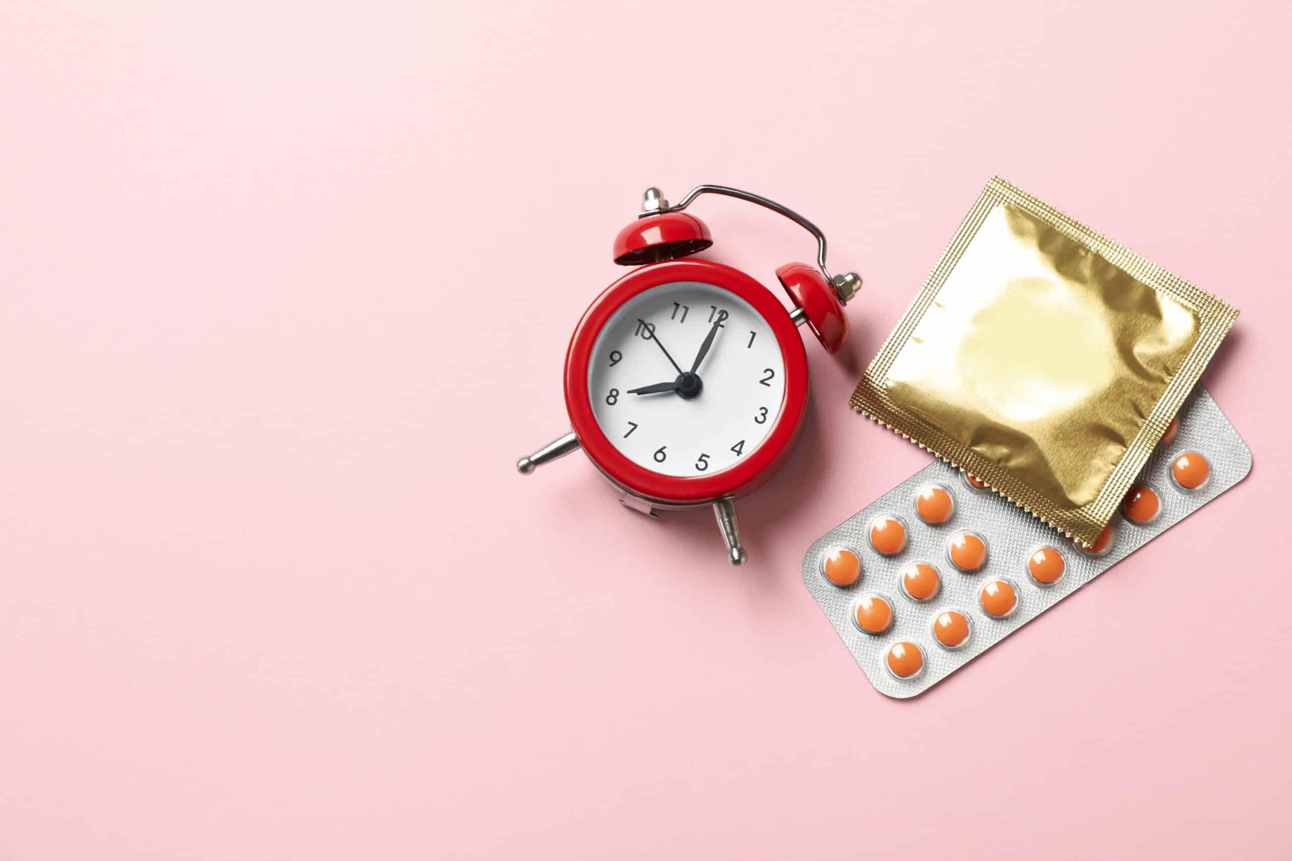 alarm clock condom and pills on pink background 2021 08 31 23 38 33 utc scaled