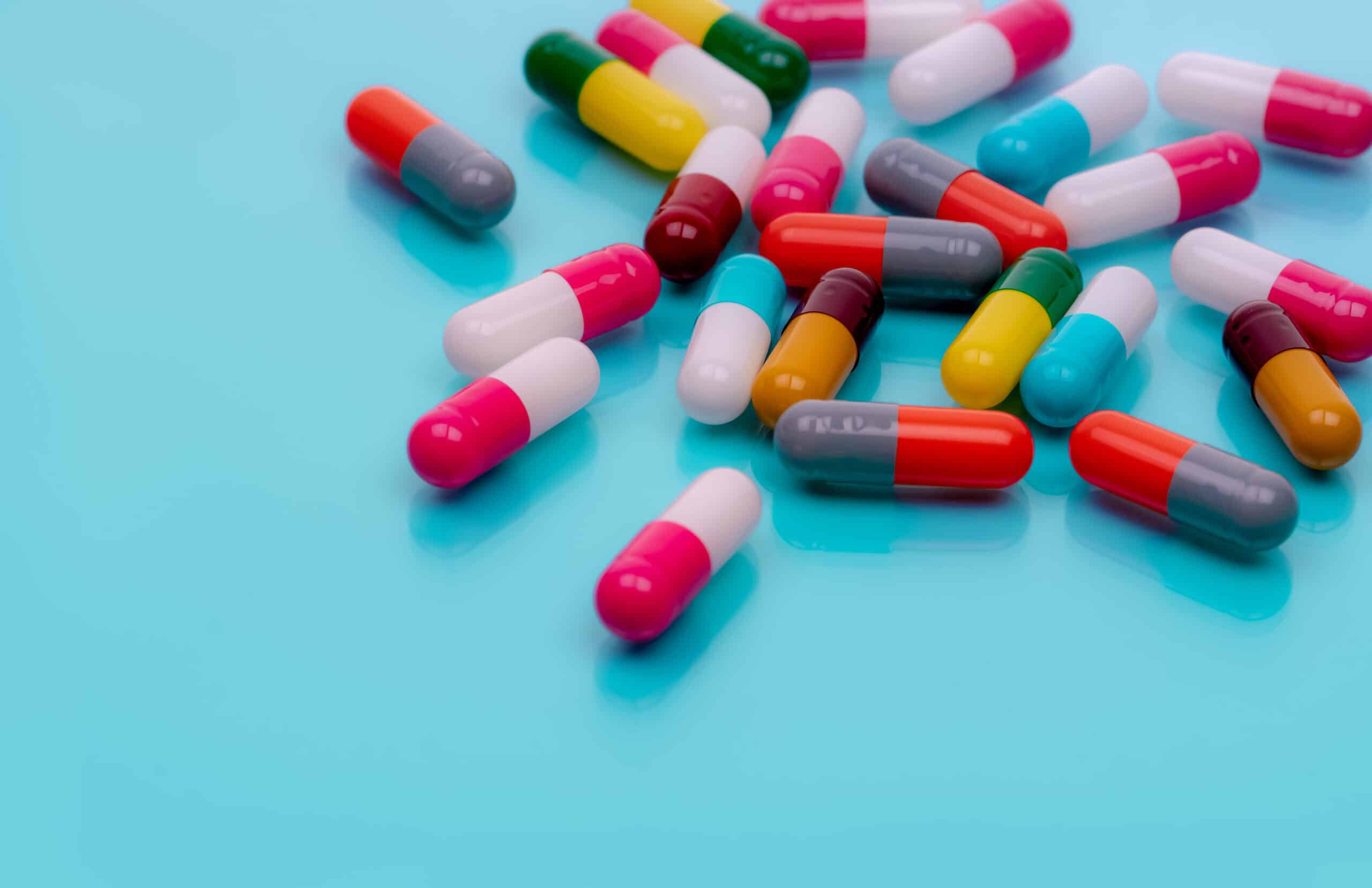 antibiotic capsule pills on blue background presc 2022 10 25 10 04 47 utc scaled