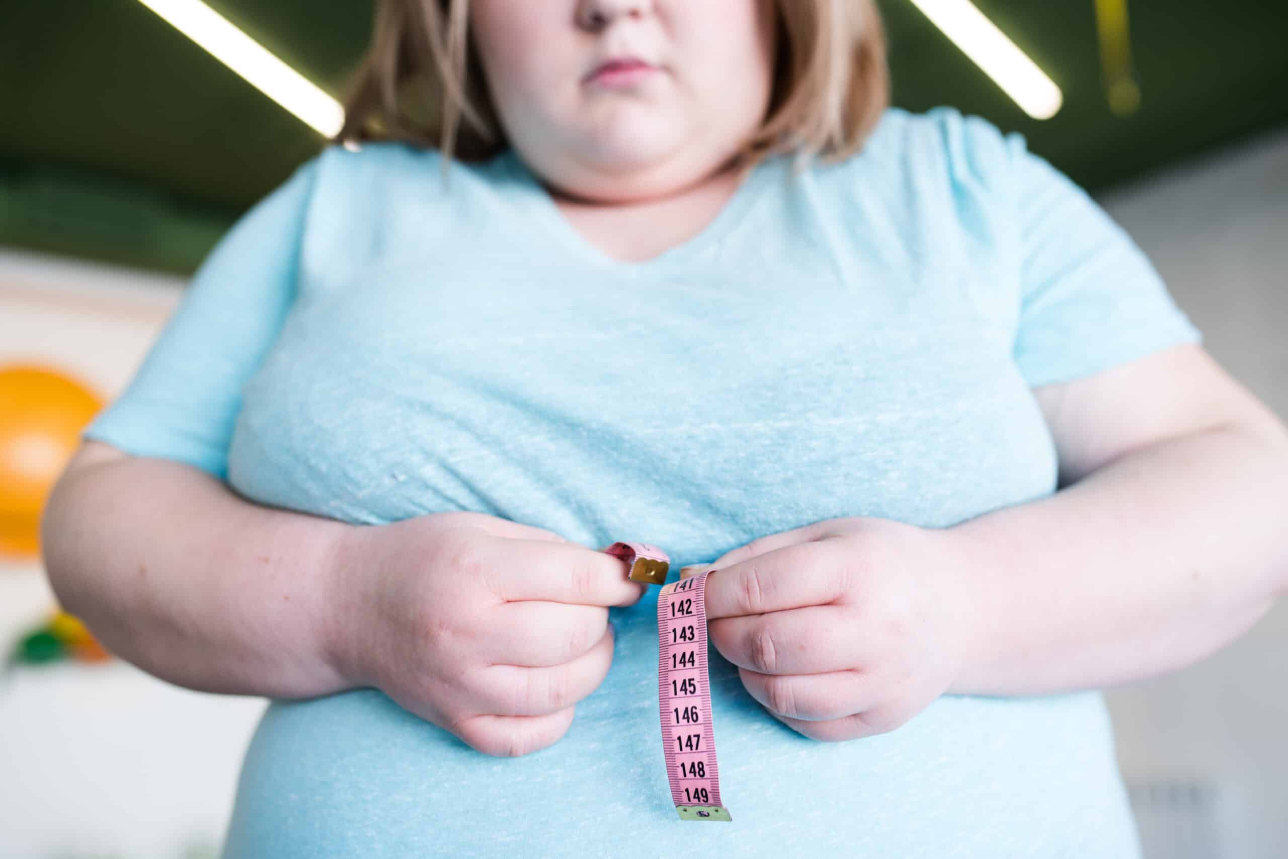 obese woman measuring waist 2021 09 24 04 02 31 utc scaled