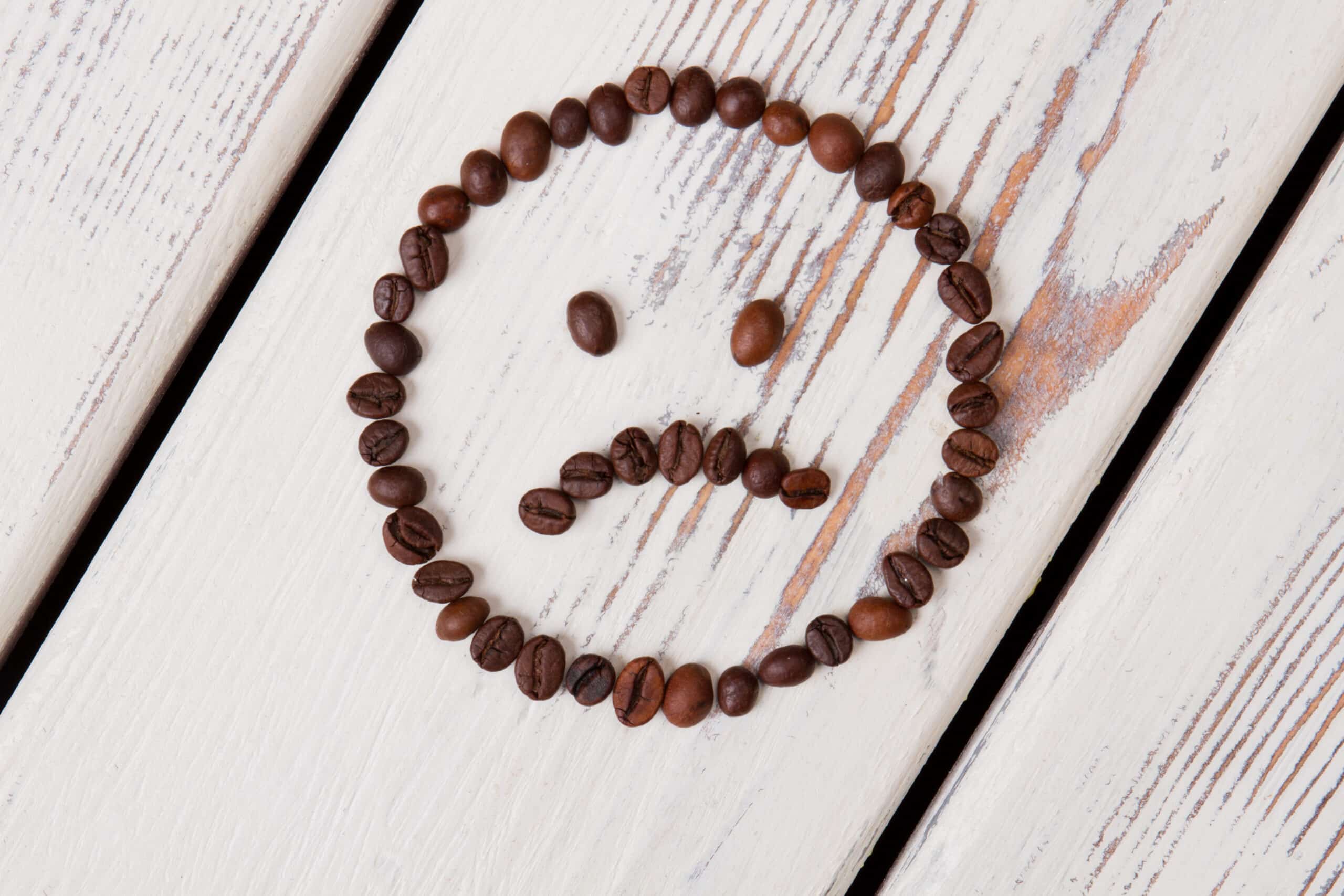 sad smiley face made of coffee beans 2021 12 09 13 17 14 utc scaled