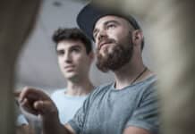 Two young men at office reception