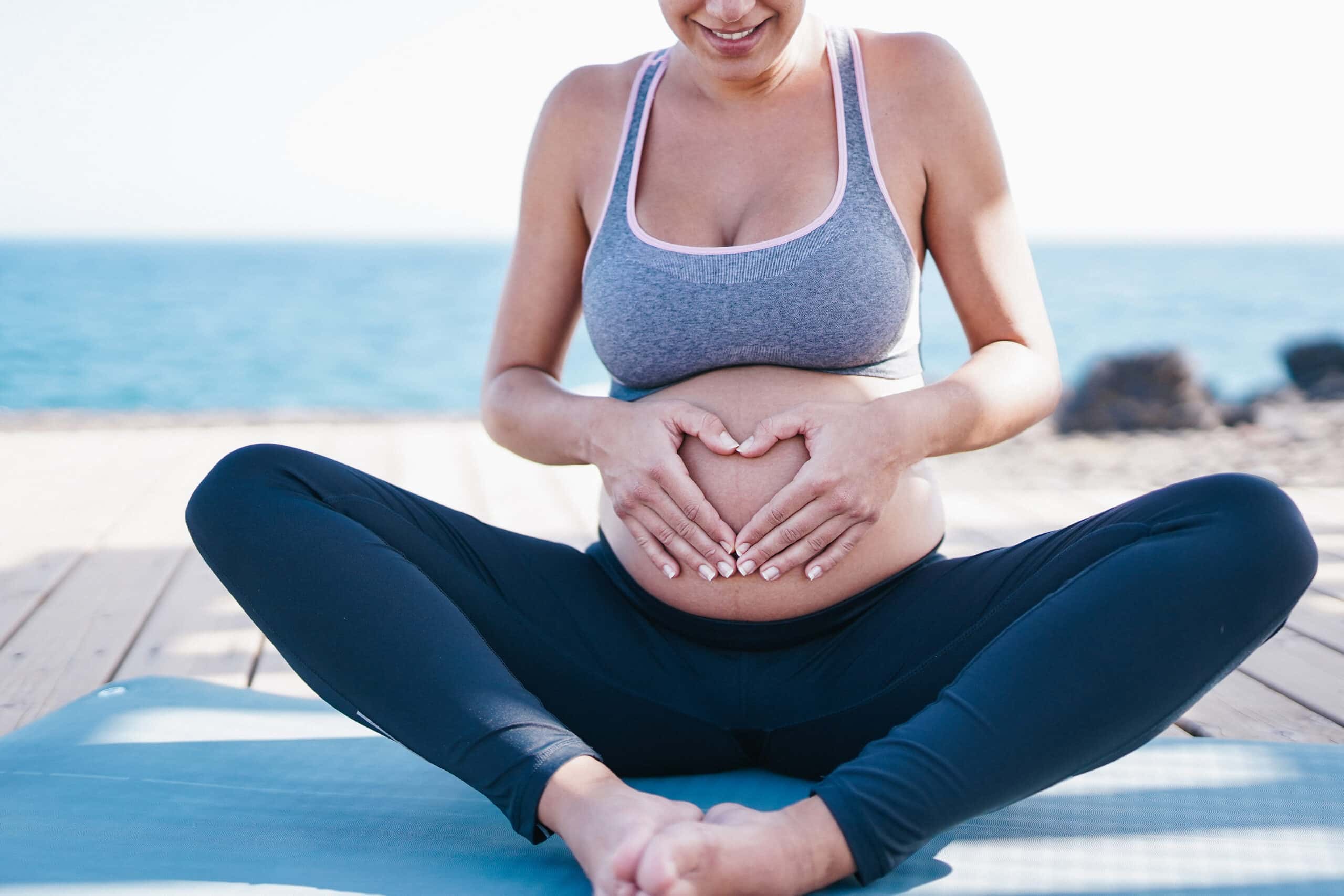 young pregnant woman after yoga exercise outdoor o 2021 09 03 10 16 40 utc scaled