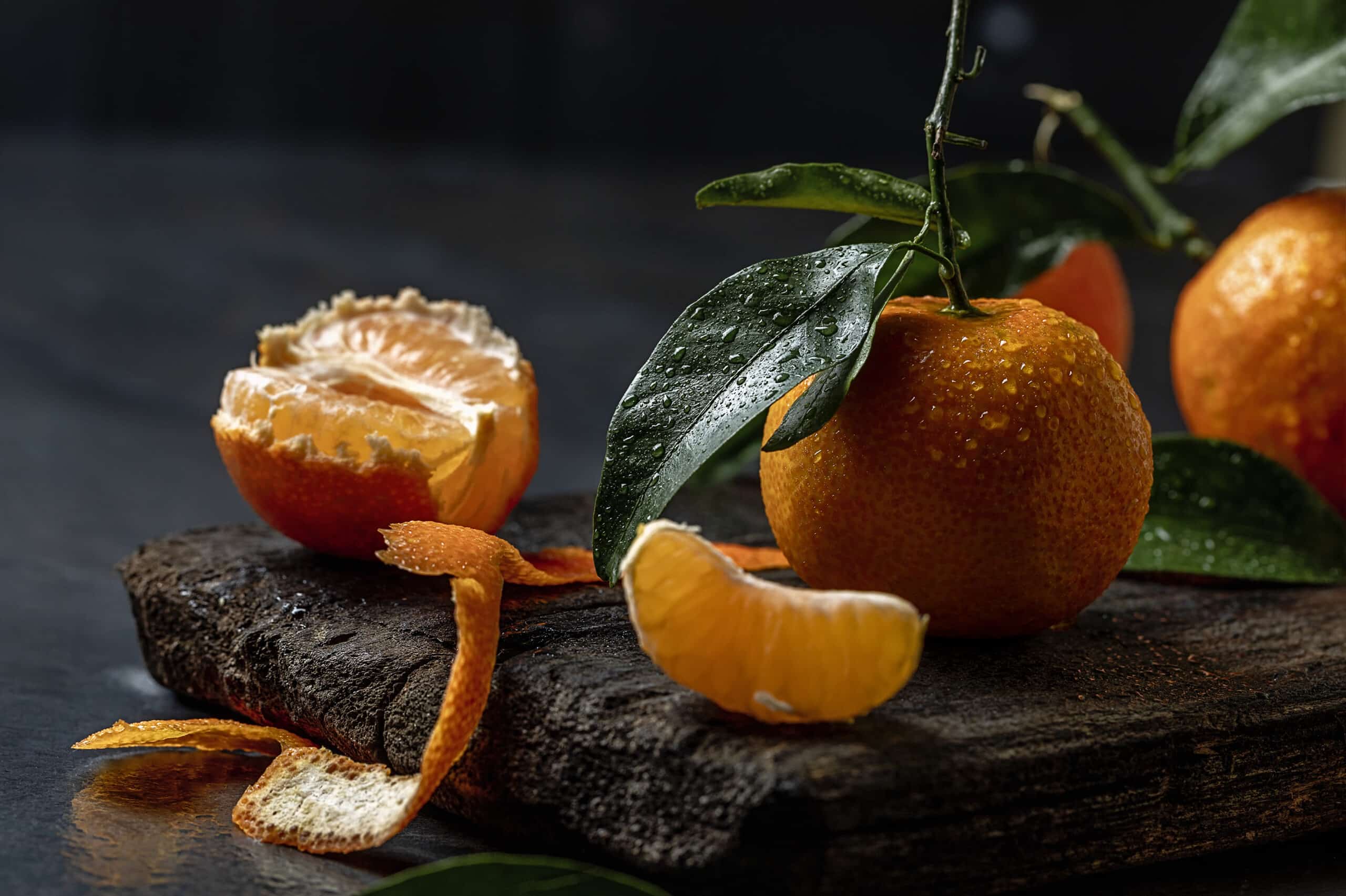 fresh tangerines on dark background