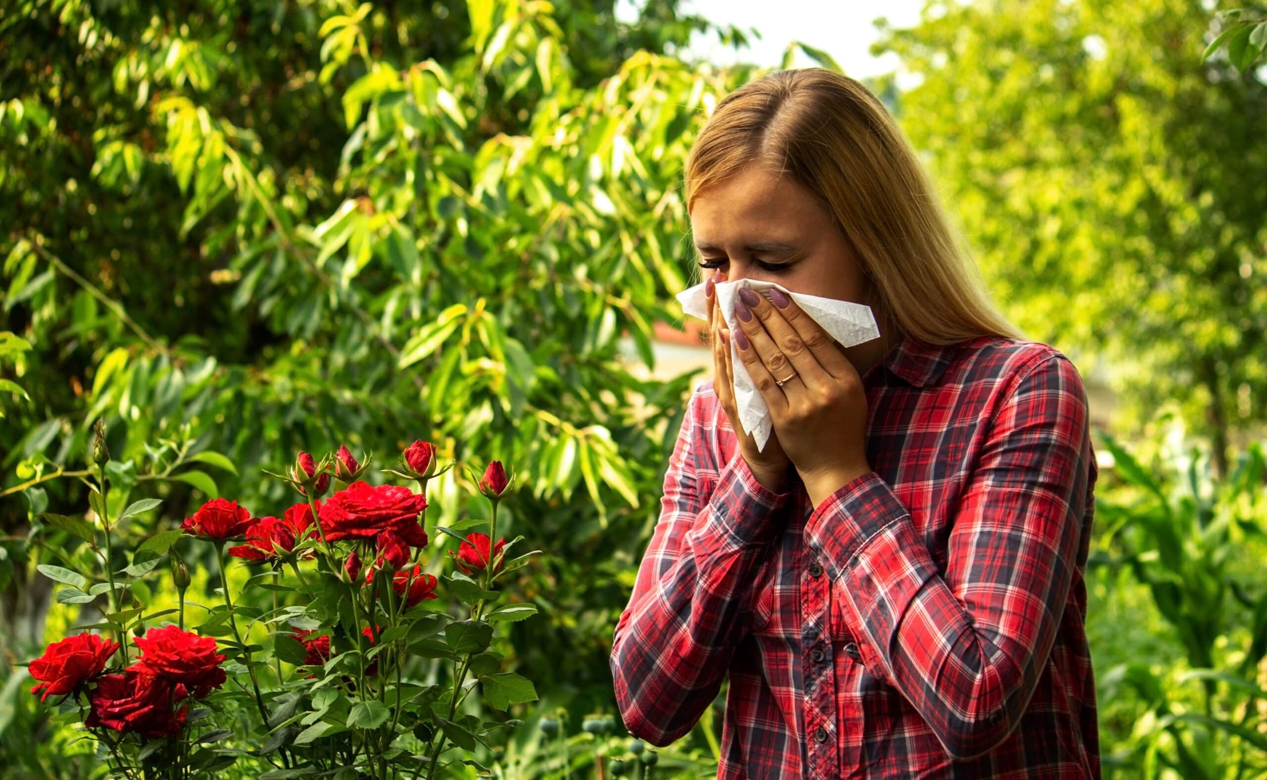 Girl's allergy to flowers. Selective focus