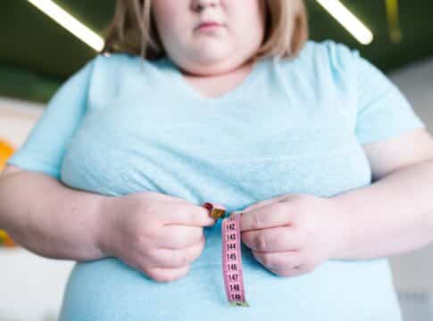 Obese Woman Measuring Waist