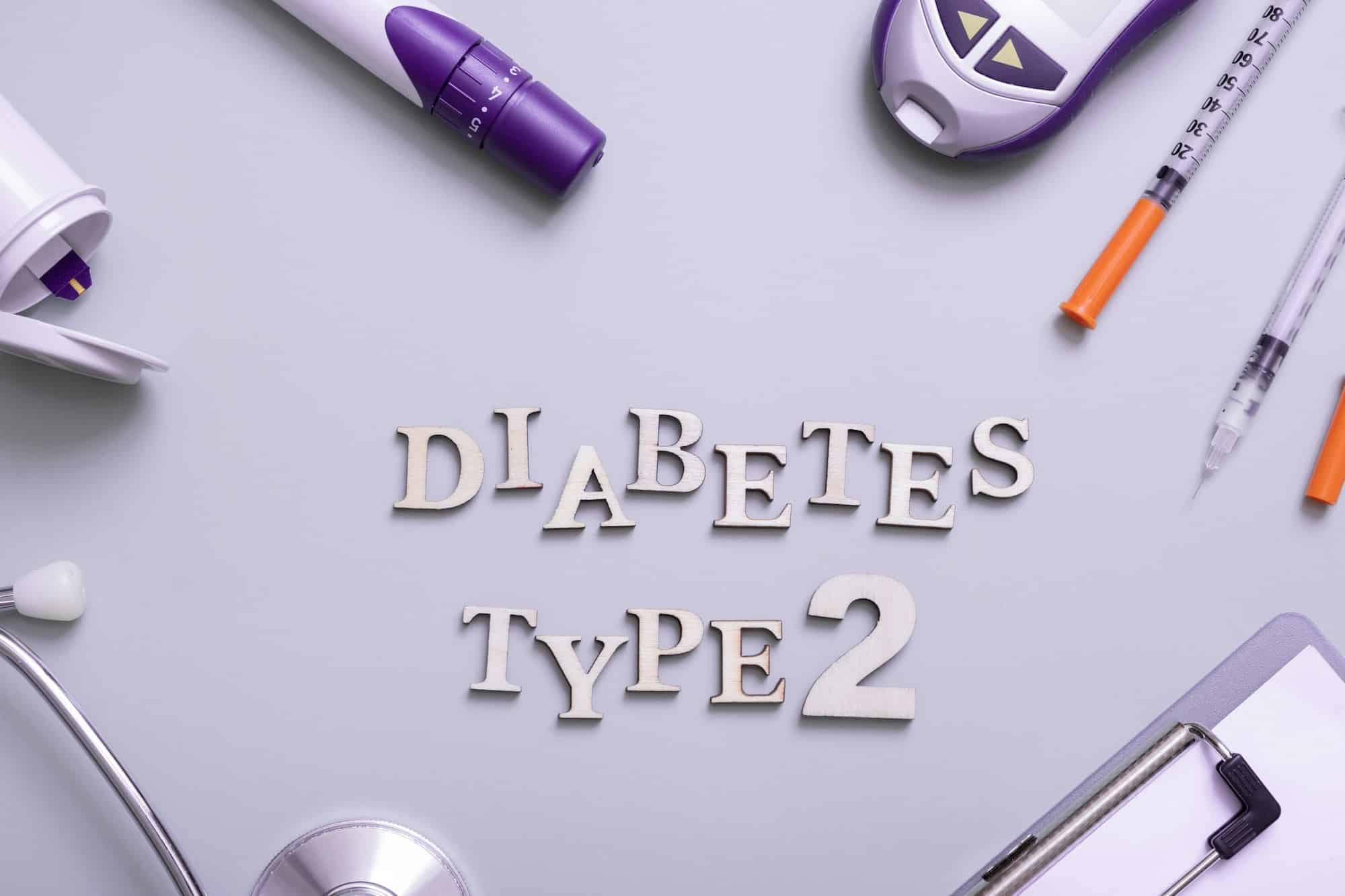 Inscription diabetes type 2 and glucometer, syringes and medical equipment